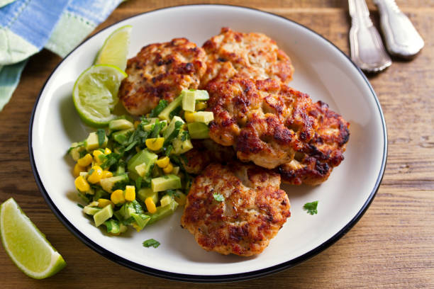 istock Chicken patties or  burgers with avocado corn salsa 1031001692