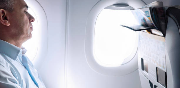 istock Businessman sleeping in airplane 1031015108