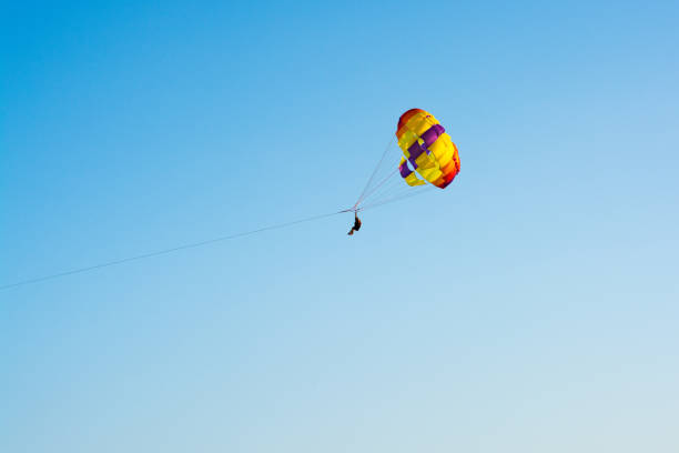 istock Paragliding along beautiful coastline 1031015132