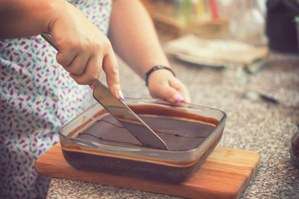 istock Woman Preparing Chocolate Brownies 1031017654