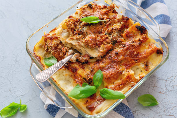 istock Pan with stuffed cannelloni with cream sauce. 1031017698