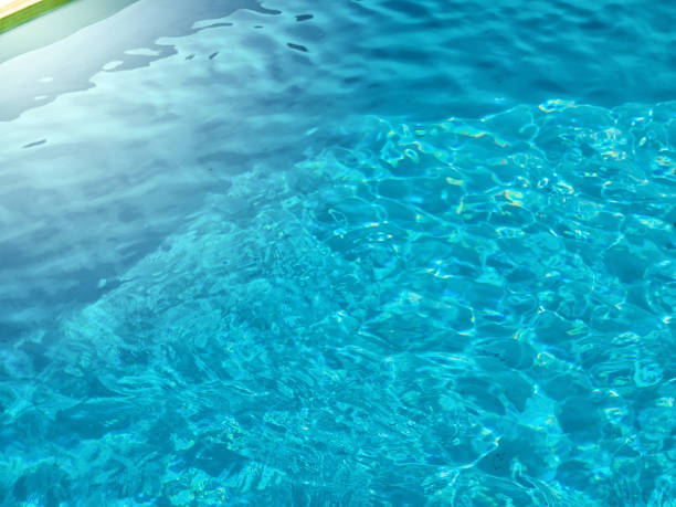 istock background of blue clear water with highlights 1031018750