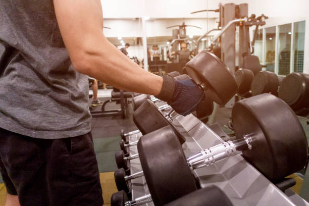 istock Human Hand holding dumbbell in gym 1031022024