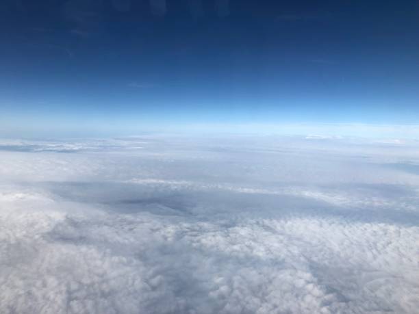 istock sunset horizon seen from an airplane window above indonesia 1031022376