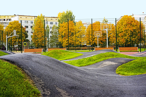 Bicycle track road. Located in city playground.