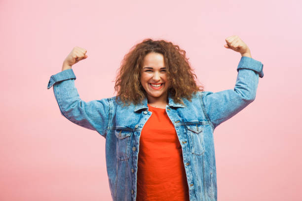 istock Young woman show power in arms 1031033866