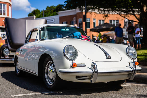 Attendees admire a restored classic Porsche at the Matthews Auto Reunion stock photo