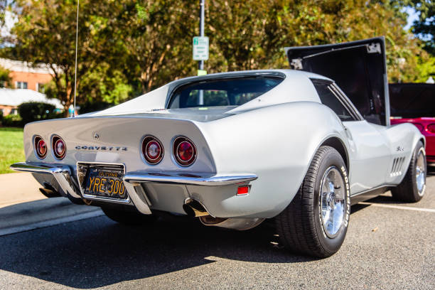 Matthews, North Carolina - September 3, 2018: A vintage 70s era silver Chevrolet Corvette Stingray is parked on display with its hood open at the Matthews Auto Reunion