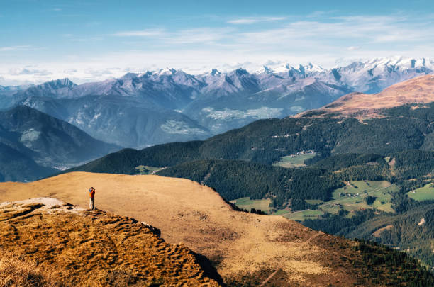 istock Traveler stands at Seceda in Dolomites, Italy 1031037378