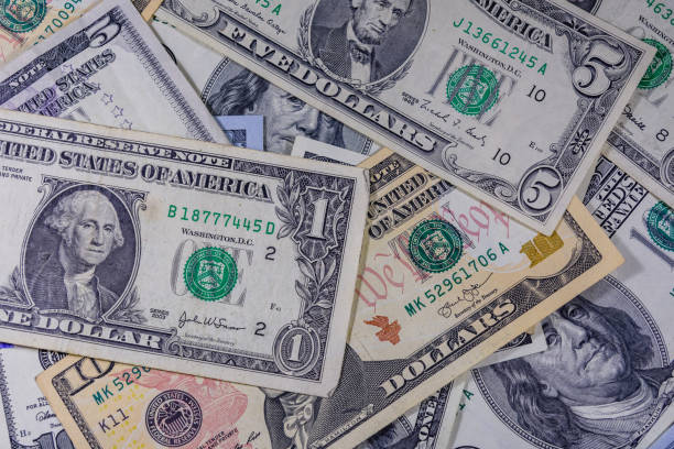istock Background of different american dollar banknotes 1031038904