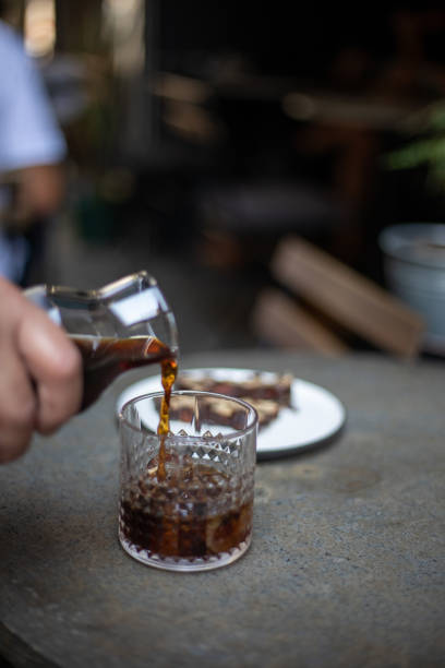 istock Cold brew coffee with ice on wooden table 1031048982