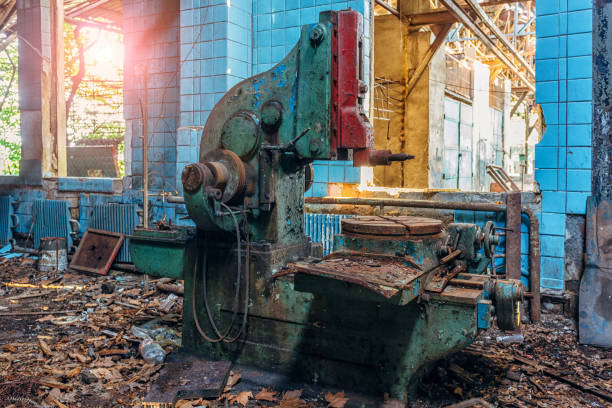istock Old industrial machine tools. Rusty metal equipment in abandoned factory 1031055608