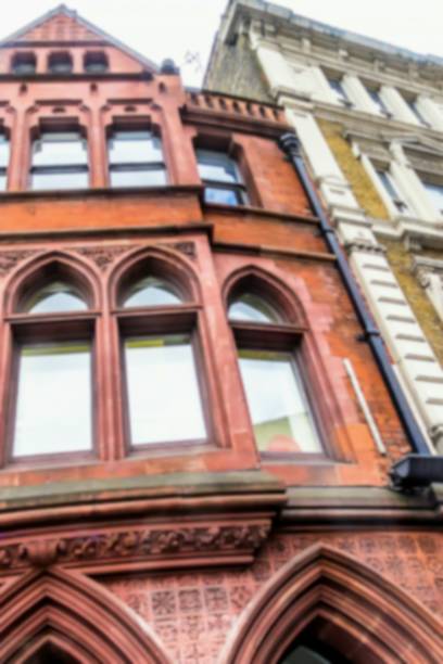 istock Blurred view of historical red brick building in London 1031056332