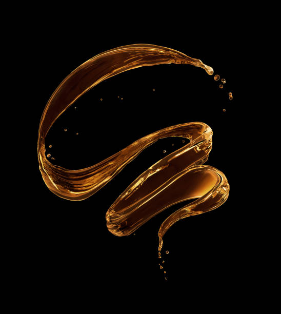 istock Splashes of oily liquid in a swirling shape on a black background 1031059988