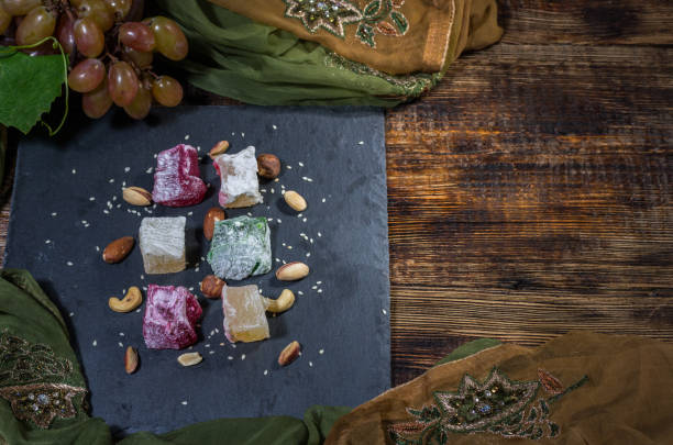 istock Multicolored rakhat lukum. Fresh green grapes. Top 1031060160