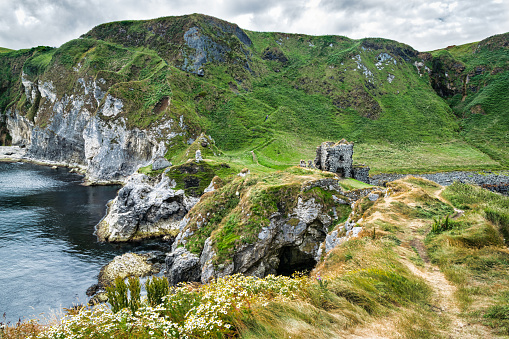 Thi is Kinbane Castle which was built on a small peninsula of sea cliffs that protrude into the Atlantic Ocean close to the town of Ballycastle in Northern Ireland.