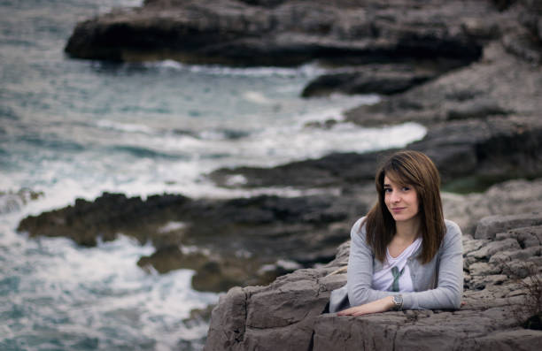 istock Woman On The Rocks 1031088284