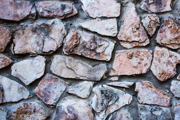 istock Close up of natural stone wall. Stone wall texture 1031099156