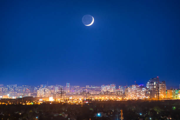 istock City at night with new moon 1031099786