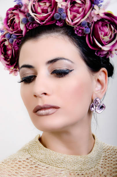 istock woman with a chaplet on a head 1031106300