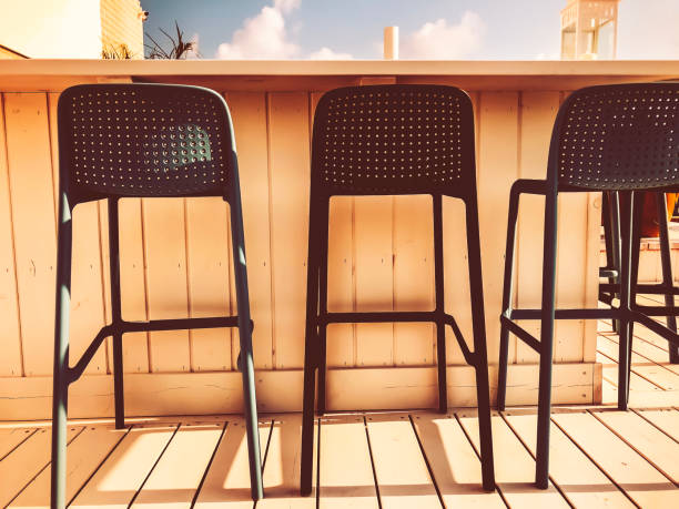 istock Vacant seats at the open-air bar on the roof 1031106448