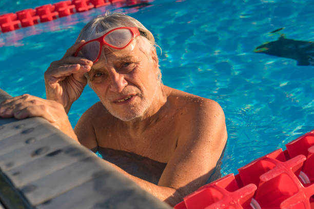 istock Senior man in swimming pool 1031109254