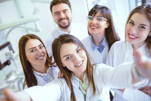 istock Group of Dentists Students Make Selfie in Clinic 1031128606