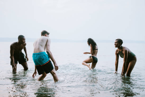 istock Young Adult Friends Explore Waterfront in Summer 1031151394