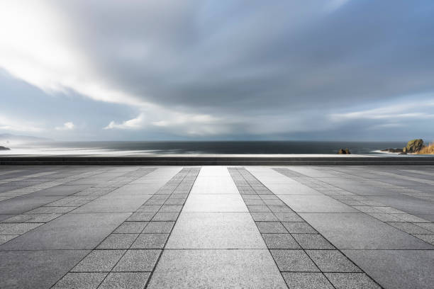 istock empty parking lot by sea against sky 1031164450