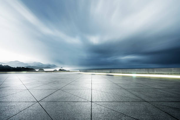 istock empty parking lot front of mountain ranges against sky 1031164610