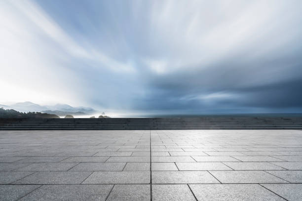 istock empty parking lot front of mountain ranges against sky 1031164644