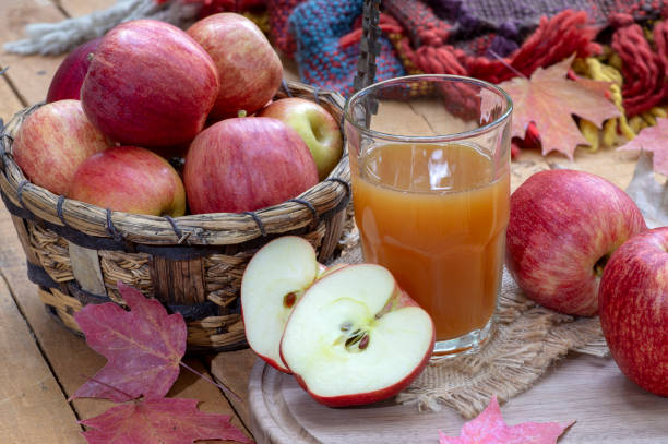istock Glass of Apple Cider and Fresh Red Apples 1031164892