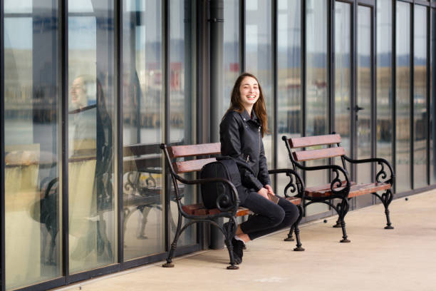 istock Girl sitting on a bench 1031169624