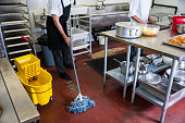 Mopping the floor in a commercial kitchen