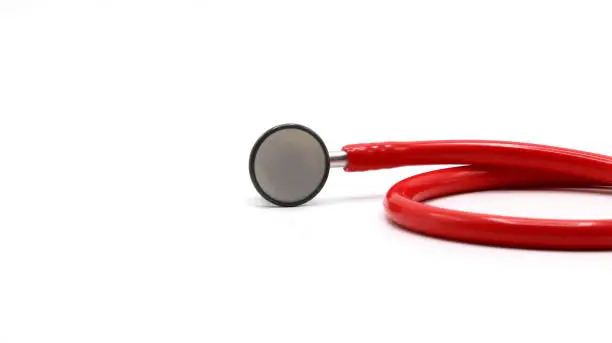 Red color stethoscope isolated on white background