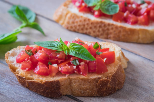 istock Bruschetta bread with chopped tomato and basil 1031199118
