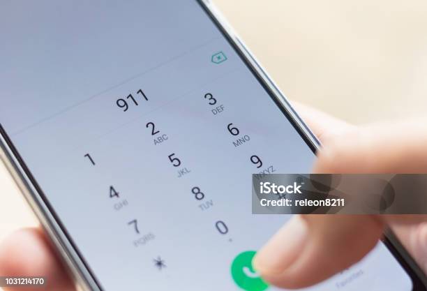 Emergency And Urgency Dialing 911 On Smartphone Screen Shallow Depth Of Field Stock Photo - Download Image Now