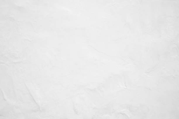 istock White pastel rough crack cement texture stone concrete,rock plastered stucco wall; painted flat fade background gray solid floor grain. 1031221084