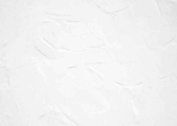 istock White pastel rough crack cement texture stone concrete,rock plastered stucco wall; painted flat fade background gray solid floor grain. 1031221092