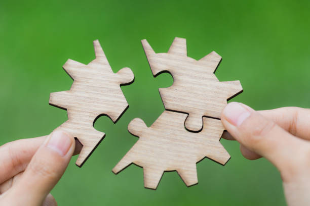 istock Hand placing the last jigsaw puzzle piece,conceptual of problem solving, Business solutions, target, successful, goals and strategy concepts 1031221540