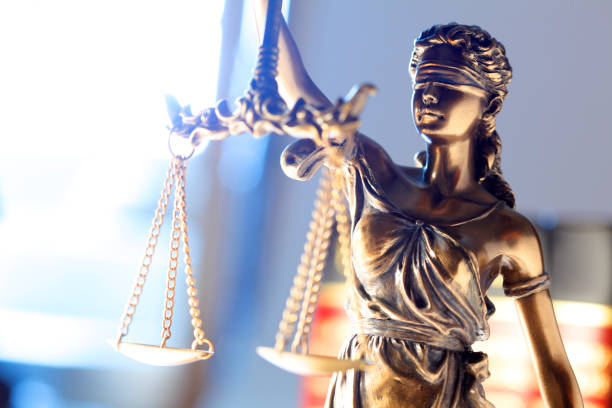 istock Lady Justice Statue In Front Of Law Books 1031241012