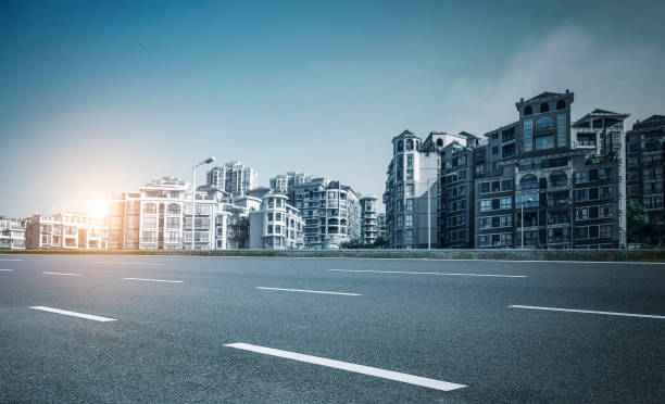 istock Asphalt highway in the city at sunset, blue tones 1031245890