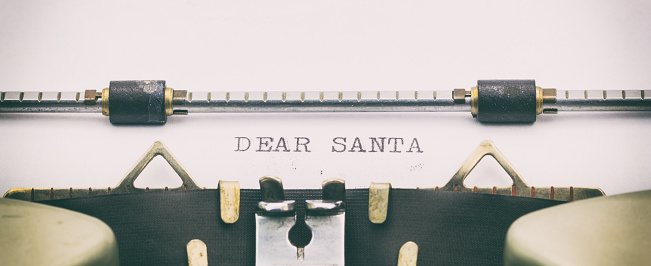 Close-up of of words Dear Santa on typewriter sheet