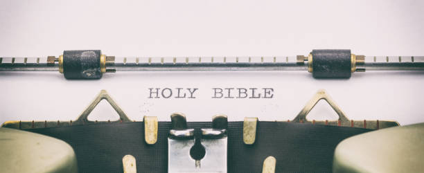 istock Holy Bible words in capital letters on white sheet 1031254710