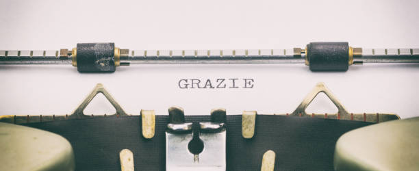 istock Grazie word in capital letters on white sheet 1031254722