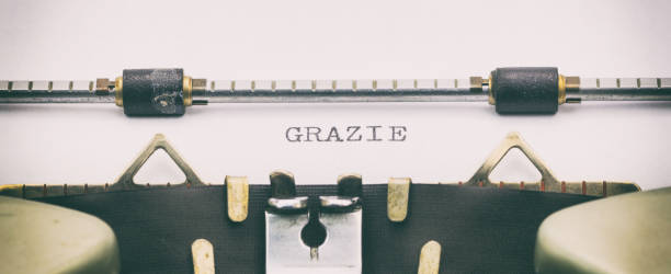 grazie word in capital letters on white sheet - column italy italian culture greece imagens e fotografias de stock