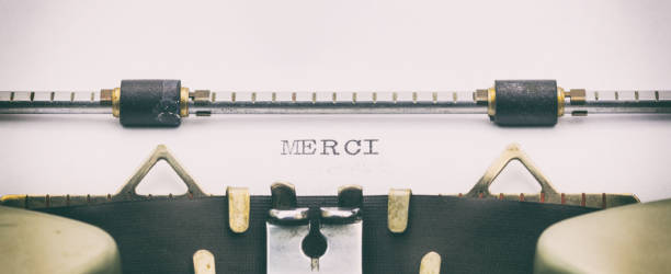 istock Merci word in capital letters on white sheet 1031254724
