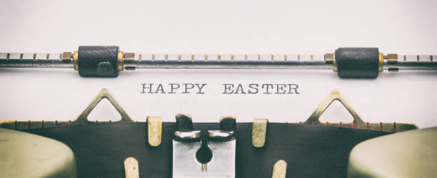istock Happy Easter words in capital letters on white sheet 1031254728