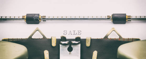 istock Sale word in capital letters on white sheet 1031254782