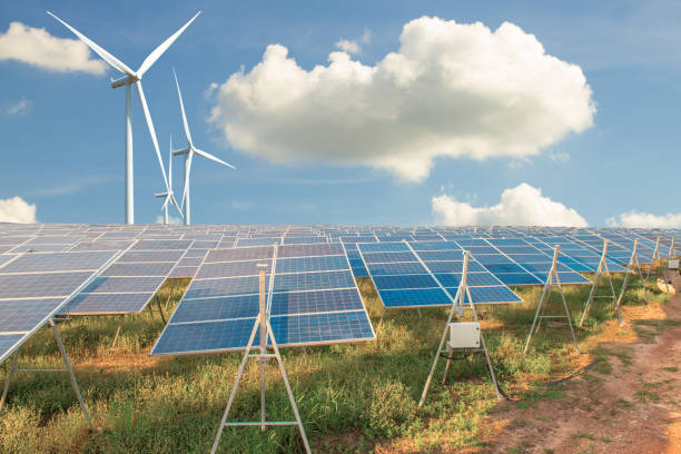 istock Beautiful Solar panels with wind turbines landscape blue sky 1031269808
